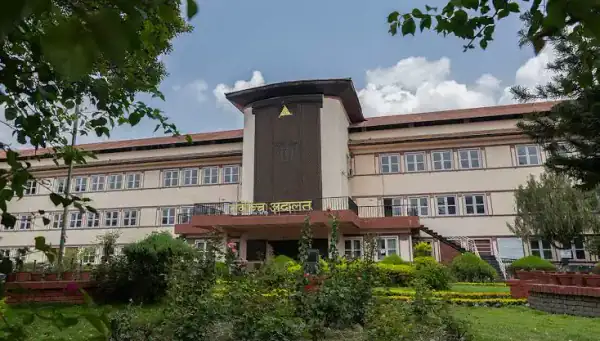 Court building at dusk — Gitanjali Law Firm appears before Kaski District Court and High Court Pokhara