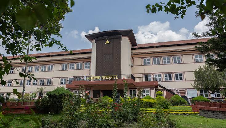 Court building at dusk — Gitanjali Law Firm appears before Kaski District Court and High Court Pokhara